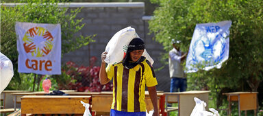WFP/Ammar Bamatraf Das Logo von WFP und Care